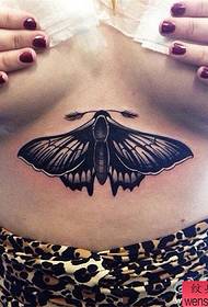 woman chest moth tattoo works