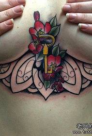 woman chest creative tattoo work