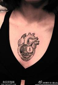 female chest heart tattoo pattern