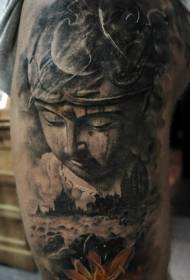 shoulder gray realistic photo of Buddha statue with lotus tattoo