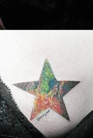 girls a beautifully colored starry five-pointed star tattoo on the chest