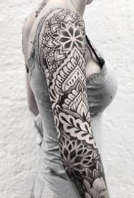 Flower Flower Arm Tattoo: A set of black and gray thorn flowering totem tattoo flower arm works