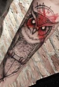 Nice-looking dark owl tattoo on the arm