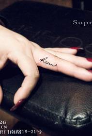 Girl finger english tattoo