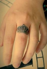 Finger crown ring tattoo