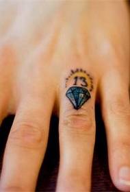 Small diamond tattoo on the finger