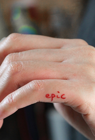 Small English alphabet tattoo on the finger