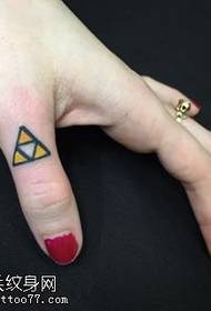 Triangular tattoo pattern on the finger