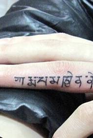 Small and individual finger Sanskrit tattoo