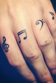 Black music symbol tattoo pattern on finger