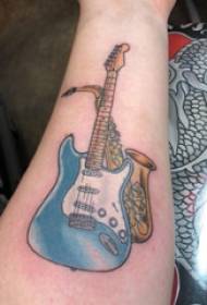 Electric guitar tattoo girl arm on saxophone and guitar tattoo picture