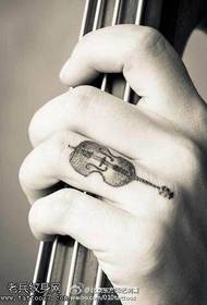 Beautiful violin tattoo on the finger