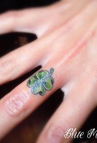 Little skull tattoo on finger