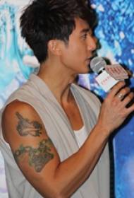 Chinese tattoo star Wu Zun arm on dagger and chain tattoo picture