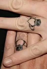 Couple heart shaped ring tattoo