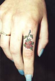Little red rose tattoo on finger