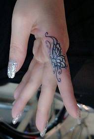 Female finger beautiful butterfly tattoo