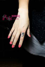 Cute cat ring finger tattoo picture
