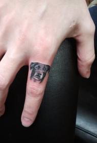Modèle de tatouage avatar chiot mignon doigt