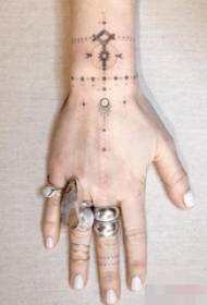 A set of black and white simple personality line tattoos on a set of fingers
