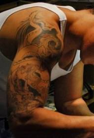 Tattoo artist movie tattooed dragon tattoo picture on the character arm