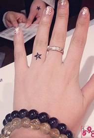 Slender finger cute little star tattoo picture