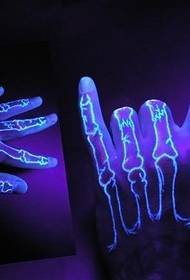 Fluorescent invisible tattoo pattern on the finger joint