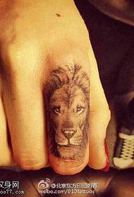 Beautiful lion head tattoo on finger