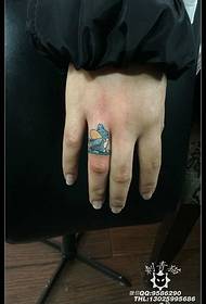 Totoro tattoo pattern on the finger