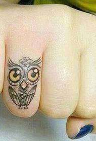 Cute owl tattoo on finger