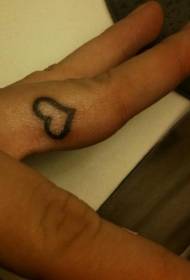Small heart symbol tattoo pattern on the finger