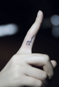 Small English letter tattoo on finger