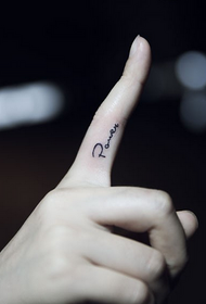 Small English word tattoo on finger