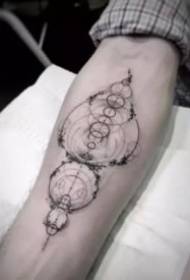 Nice-looking dot-line geometric design tattoo on the arm