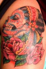 old style painted Mexican female skull with flower tattoo
