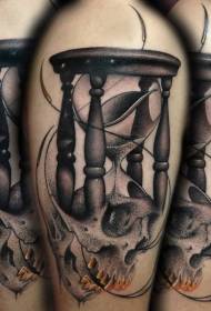 Shoulder black sand clock and human skull tattoo picture