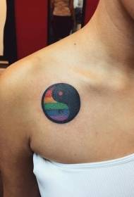Iridescent yin and yang gossip symbol tattoo on the shoulder