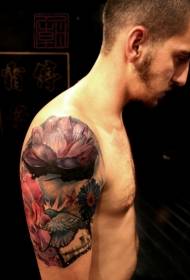 Big arm beautifully painted lotus with bird tattoo pattern