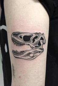 Ručni trn u obliku crne dinosaurske tetovaže lubanje uzorak