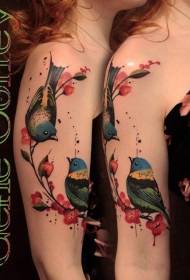 Big arm colored bird and blooming flower tattoo pattern