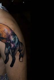 Starry wolf tattoo pattern on the shoulder