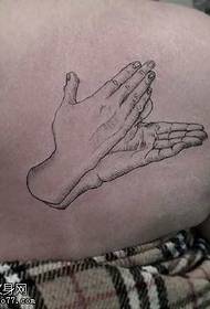 Shoulder pricked hands tattoo pattern