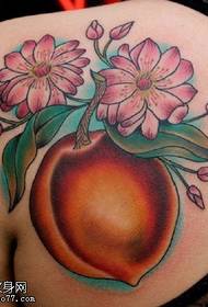 Big peach tattoo pattern on the shoulder