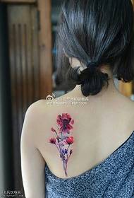 a bouquet of floral tattoos on the shoulders