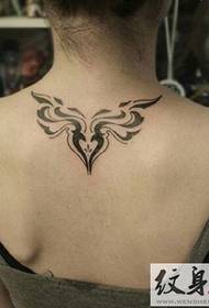 Small totem tattoo on the shoulder and back