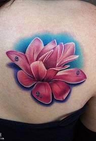 a flower tattoo pattern on the shoulder