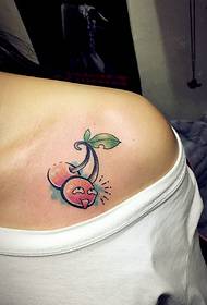 Colorful fruit tattoo pattern under the shoulder of a girl