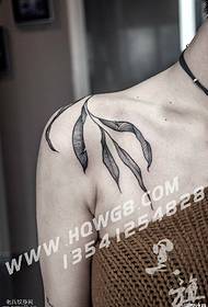 a willow tattoo on the shoulder