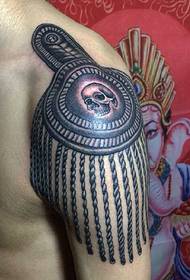 Alternative black and white totem tattoo falling on the shoulder