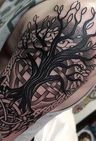 Old tree tattoo pattern on the shoulder